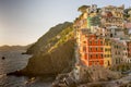 Golden sunset at the cliff at the Italian Riviera in the Village of Riomaggiore, Cinque Terre, Italy Royalty Free Stock Photo