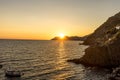 Golden sunset at the cliff at the Italian Riviera in the Village of Riomaggiore, Cinque Terre, Italy Royalty Free Stock Photo