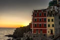 Golden sunset at the cliff at the Italian Riviera in the Village of Riomaggiore, Cinque Terre, Italy Royalty Free Stock Photo