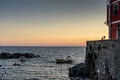 Golden sunset at the cliff at the Italian Riviera in the Village of Riomaggiore, Cinque Terre, Italy Royalty Free Stock Photo