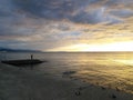 Golden sunset with fisherman