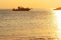 View of golden sunset, yacht and Mediterranean Sea in Greece