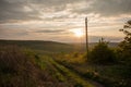 Golden sunset. Moldavian fields and hills. Spring or summer sunny down landscape.