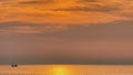 Golden Sunset Over Calm Ocean With Dramatic Clouds Royalty Free Stock Photo