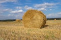 Golden sunset over farm field with hay bales Royalty Free Stock Photo