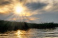 Golden sunset over lake Balaton with reeds and sunbeam Royalty Free Stock Photo