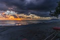 Dark shot of majestic sunset over ocean waves