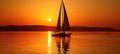 Golden Sunset over Ocean with Sailboat Emphasizing Tranquil Grandeur of the Moment Royalty Free Stock Photo