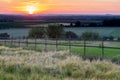 A golden sunset over the rolling hills in Banholt, south Limburg in the Netherlands creating holiday vibes Royalty Free Stock Photo