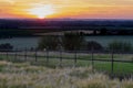 A golden sunset over the rolling hills in Banholt, south Limburg in the Netherlands creating holiday vibes Royalty Free Stock Photo