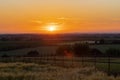 A golden sunset over the rolling hills in Banholt, south Limburg in the Netherlands creating holiday vibes Royalty Free Stock Photo