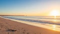 Golden Sunset Over a Sandy Beach with Gentle Waves and Clear Blue Sky 20260110 Royalty Free Stock Photo