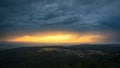 Golden sunset over the upper Rhine plain while a summer storm passes over the Black Forest