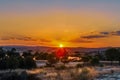 Golden sunset with rays in the haze and clouds in Ayamonte, Andalucia, Spain looking accross to Portugal over the Guadiana River Royalty Free Stock Photo