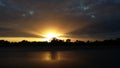 Golden Sunset Rays under Stratiform Clouds Royalty Free Stock Photo