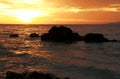 Sunset in the ocean with rocks in Thailand