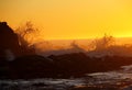 Golden sunset and splashing waves at Tofino, BC