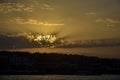 Golden sunset sun over Hurghada city in Egypt. Sun`s rays break through clouds. Magnificent landscape. Royalty Free Stock Photo