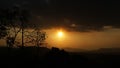 Golden sunsets with silhouette of mountains and trees. Phetchabun province, Thailand.