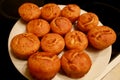 Homemade and freshly baked cornbread stuffing muffins for lunch on stovetop in kitchen. Corn pone for holidays, healthy meal.