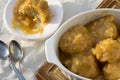 Golden Syrup Dumplings on Table with One portion on Plate