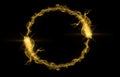 Golden tail with gold particles and smoke. Circle frame with space for text. Sparkling golden frame on black background. Bright Royalty Free Stock Photo