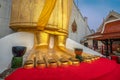 A golden tall Buddha standing at wat Intharawihan.