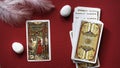 Golden tarot cards the four of wands on the red background,