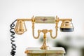 Golden telephone in retro style Royalty Free Stock Photo