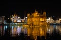 The Golden Temple at Amritsar, Punjab, India, the most sacred icon and worship place of Sikh religion. Illuminated in the night, r Royalty Free Stock Photo