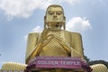 Dambulla Sri Lanka: 03/16/2019: The Golden Temple main facade of the Buddhist Museum showing closeup of the Buddha statue with the