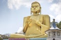 Dambulla, Sri Lanka: 03/16/2019: The Golden Temple main facade of the Buddhist Museum showing closeup of the Buddha statue . World