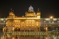 Golden temple with reflection in the water at night Royalty Free Stock Photo