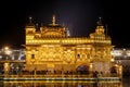Golden temple with reflection in the water at night Royalty Free Stock Photo