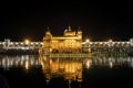 Golden temple with reflection in the water at night Royalty Free Stock Photo