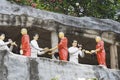 Dambulla Sri Lanka: 03/16/2019: The Golden Temple temple and museum garden with resin figures worshippers. World heritage site