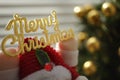 Golden text Mery Christmas in Santa Claus hands. Design card for New Year Royalty Free Stock Photo