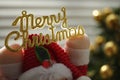 Golden text Mery Christmas in toy Santa Claus hands Royalty Free Stock Photo