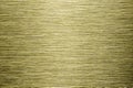 Golden texture of shiny scratched metal. Abstract gold background. Royalty Free Stock Photo