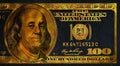golden textured 100 US dollar banknote with black background Royalty Free Stock Photo