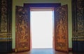 Golden Thai pattern door opened to white light. The gateway to heaven Royalty Free Stock Photo