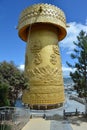 Golden tibetian prayer wheel in Guishan Park, Shangri-la, China