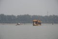 Golden tourist dragon boat on lake in China, Asia