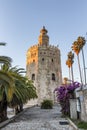 Golden tower Torre del Oro at sunset from the other side of the Guadalquivir river, Seville Andalusia, Spain Royalty Free Stock Photo