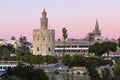 Golden tower Torre del Oro at sunset from the other side of the Guadalquivir river, Seville Andalusia, Spain Royalty Free Stock Photo