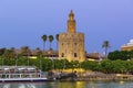 Golden tower Torre del Oro at sunset from the other side of the Guadalquivir river, Seville Andalusia, Spain Royalty Free Stock Photo