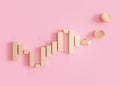 Golden trading chart with coins and copy space. Stock trade data on graph with japanese sticks, pink background. Trading Royalty Free Stock Photo