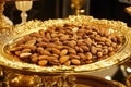 A golden tray of catanias with chocolate coated almonds. Royalty Free Stock Photo