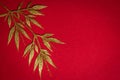 Golden tree leaves on red flannel background Royalty Free Stock Photo