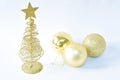 Golden tree with star on top with ball for decoration in Christmas and new year festival on white background Royalty Free Stock Photo